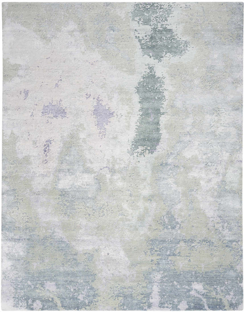 Close-up of Nourison Silk Shadows Blue Green rug. Abstract pattern in shades of blue, green, and gray. Handmade, silk-like texture.