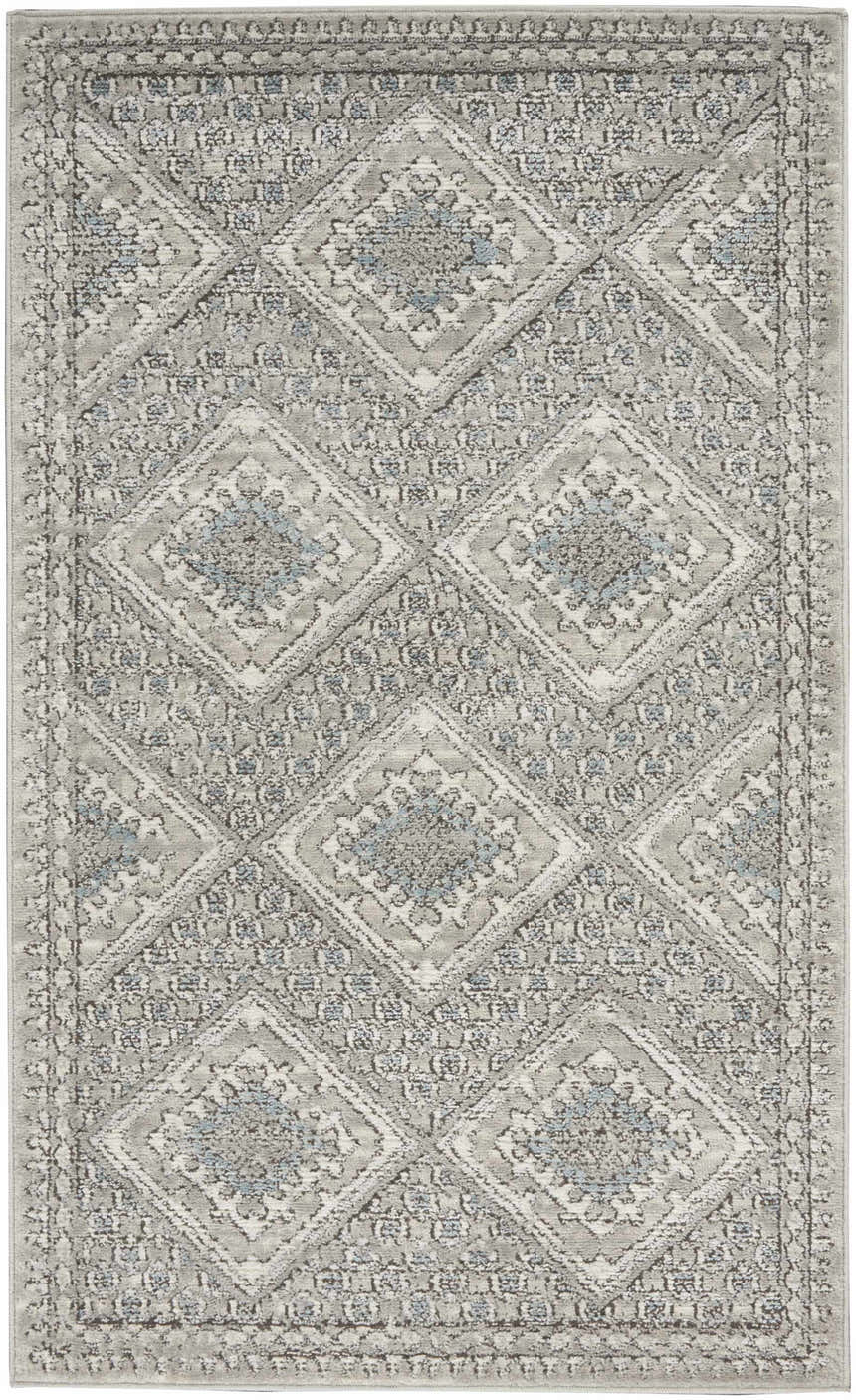Close-up of Nourison Quarry Grey Ivory Blue Southwestern rug; diamond pattern with chestnut accents.