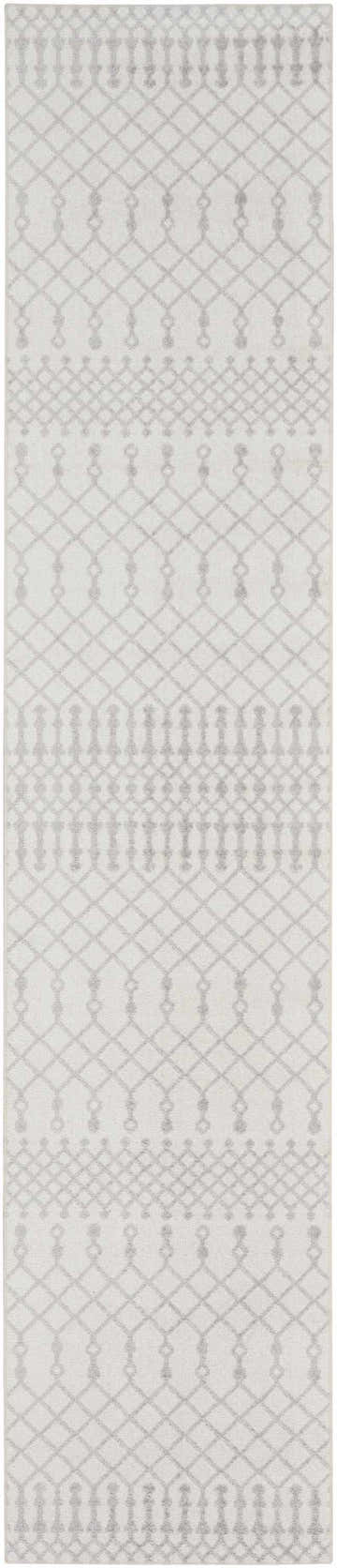 Close-up of the Nourison Astra Ivory Bohemian Rug featuring a diamond and geometric pattern in soft ivory and chestnut tones.