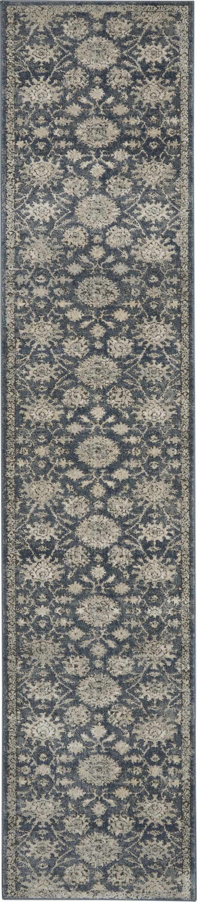 Close-up of the Nourison Quarry Blue Beige Vintage Indoor Area Rug, showing its distressed diamond pattern and soft texture.
