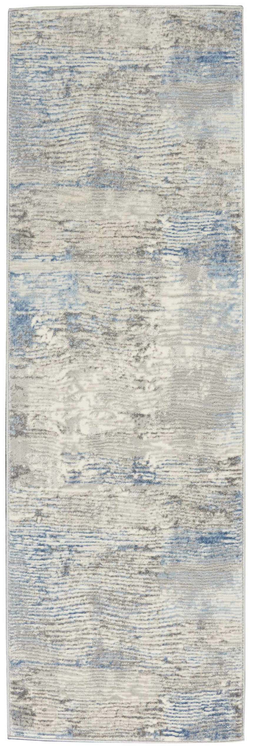 Close-up of Nourison Solace Ivory Grey Blue Rug. Modern high pile rug with abstract pattern and subtle blue accents.