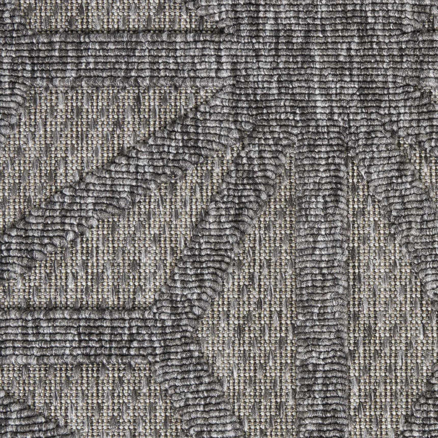Close-up of the Nourison Cozumel Dark Grey rug showing its textured, mid-century modern geometric pattern.