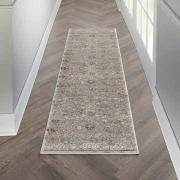 Hallway scene with Nourison Melody Grey Multicolor Bohemian rug runner on wood floor.