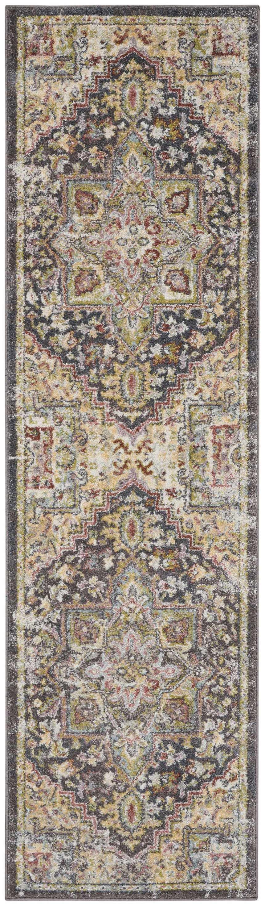 Close-up of Nourison Soraya Charcoal Multi rug. Colorful, taupe, gray, red, and green distressed geometric pattern.