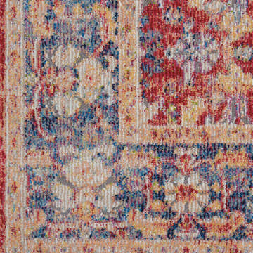 Close-up of the Nourison Ankara Global Red Vintage Area Rug, showing its detailed, colorful, distressed pattern.
