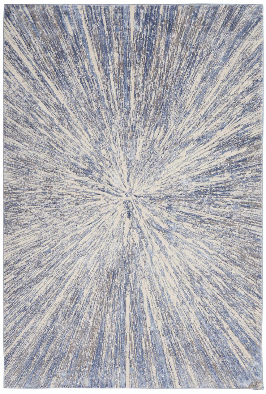 Close-up of the Nourison Silky Textures Blue Grey rug. Modern design with radiating blue, gray, and ivory pattern.