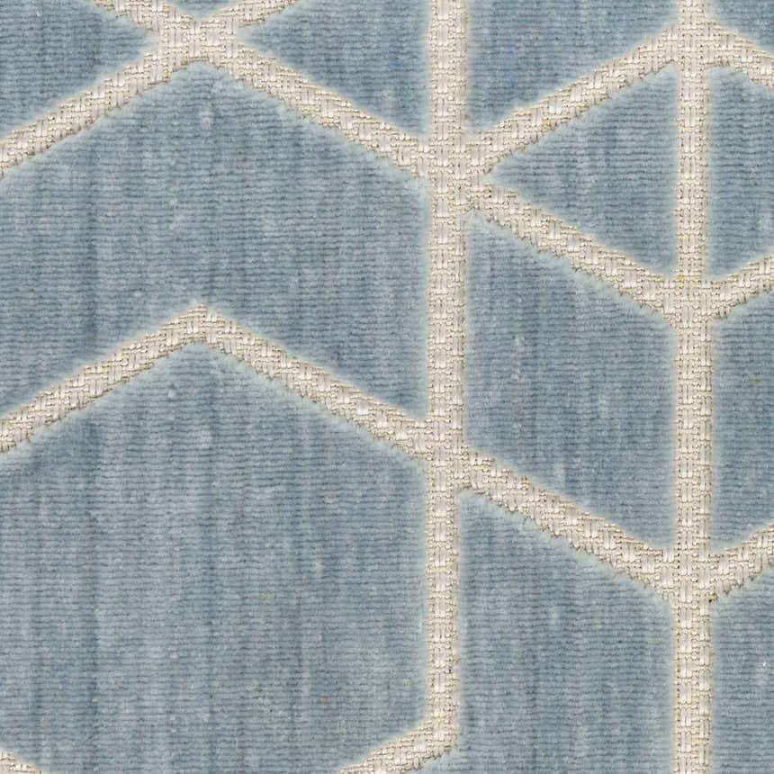 Close-up of the Nourison Charm Blue Ivory rug, featuring a geometric pattern and textured weave.