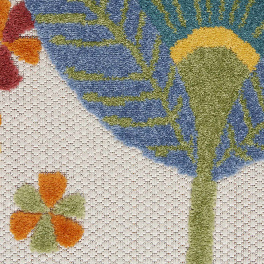 Close-up of the Nourison Aloha Multicolor Contemporary Area Rug, showing floral design in blue, green, orange, and red on a textured cream background.