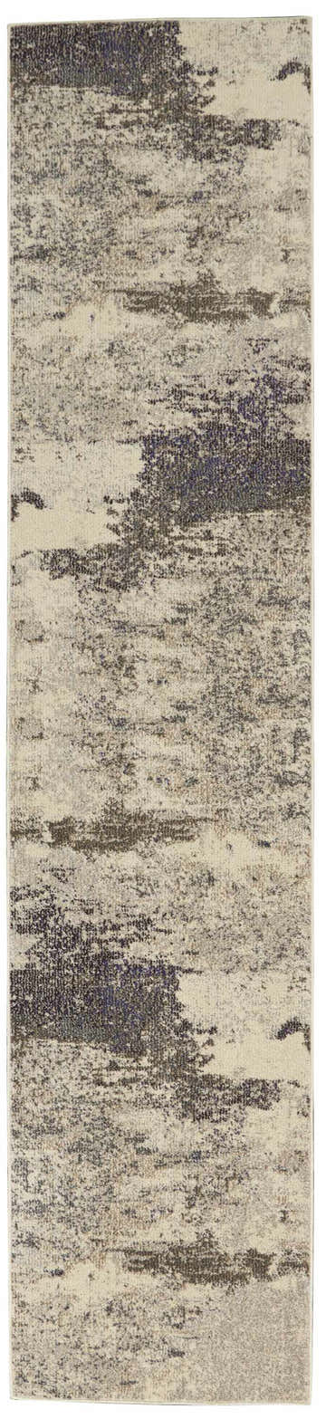 Close-up of Nourison Celestial Ivory Grey rug. Abstract pattern with chestnut and grey tones. Modern design.