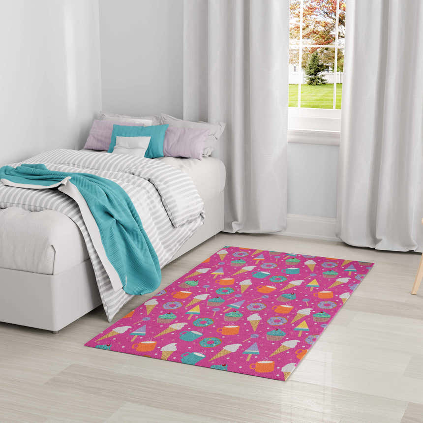 Kids room with the Nourison Imagination Pink Multicolor rug featuring a fun dessert pattern.