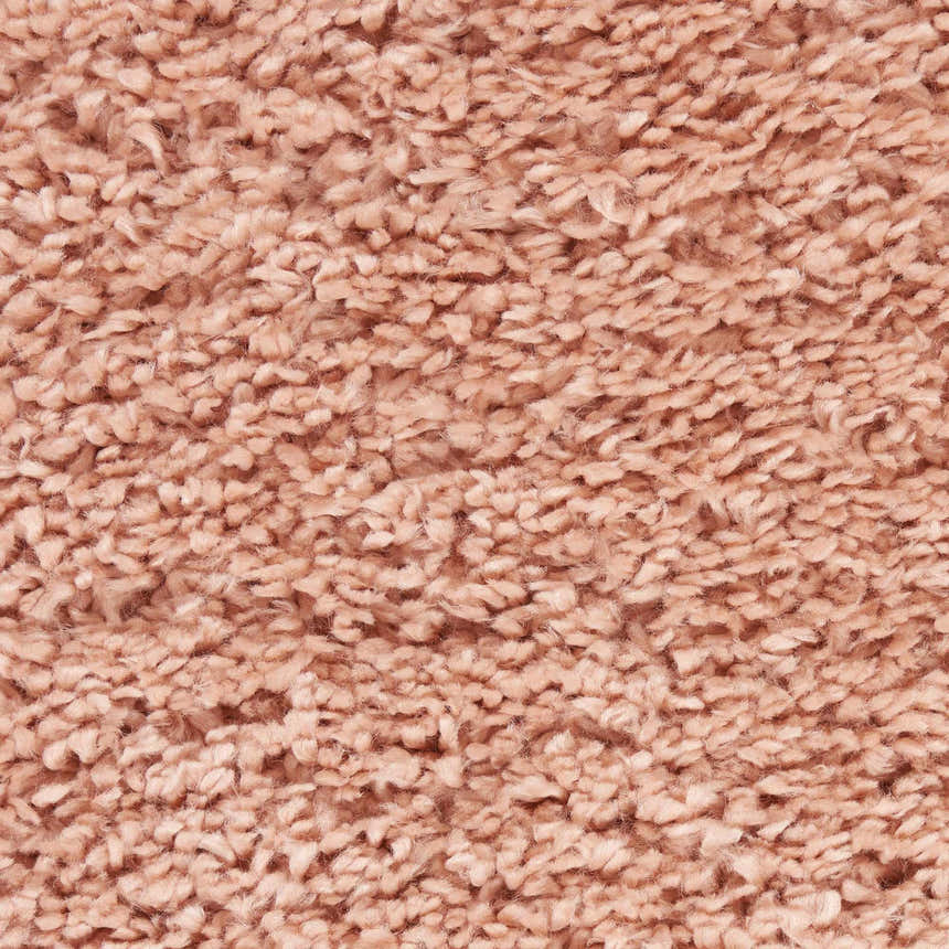 Close-up of the plush texture of the Nourison Malibu Shag Blush rug. Soft, blush pink shag rug.