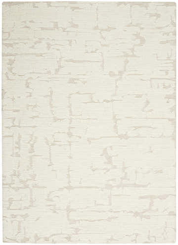 Close-up of Calvin Klein CK009 Sculptural Ivory rug. Modern design with chestnut-colored, abstract pattern and textured wool.