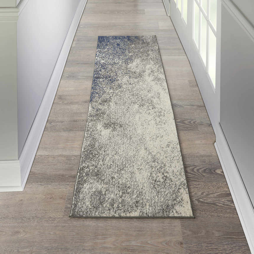 Hallway with a Nourison Passion Charcoal Ivory rug runner on wood floor.