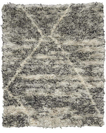 Close-up of the Calvin Klein San Antonio Charcoal Ivory rug. Shag texture with a subtle Moroccan-inspired design.