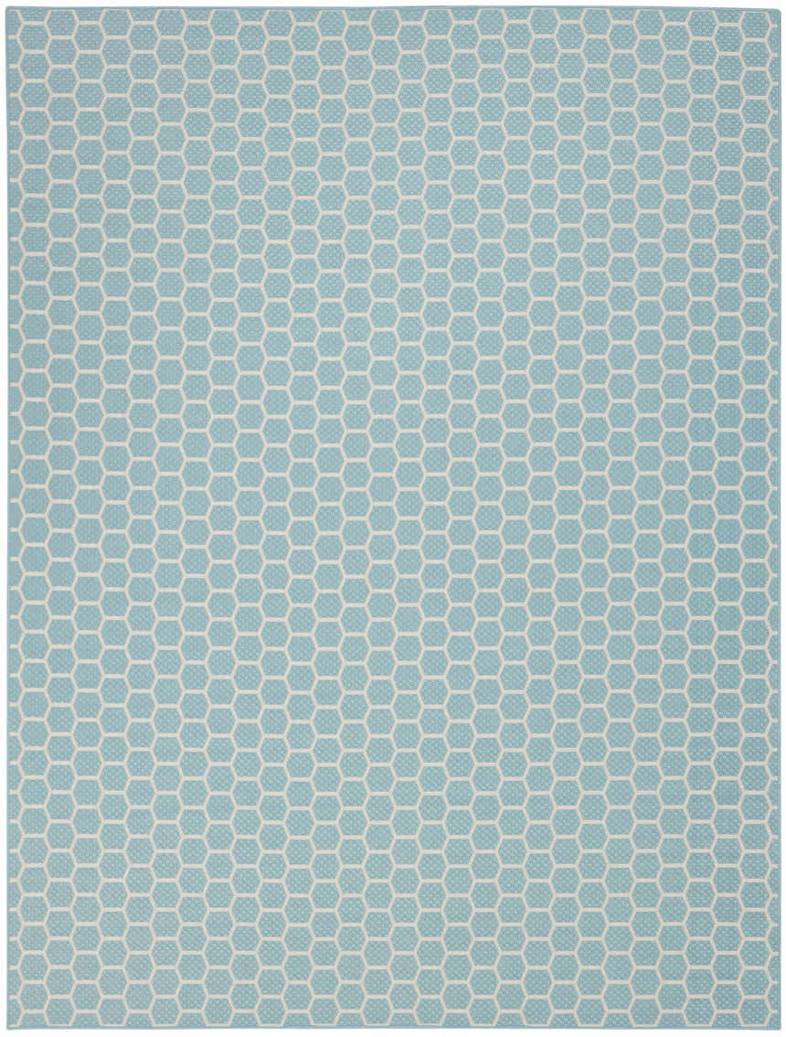 Close-up of the Nourison Twist Reversible Aqua Modern Area Rug featuring a geometric honeycomb pattern.