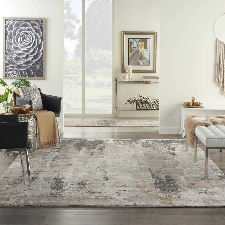Living room scene with cream walls and Nourison Tangra Cream Grey rug, black chairs, and white bench.