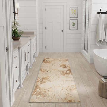 Bright bathroom with white cabinets and beige Nourison Astra Machine Washable Area Rug runner.