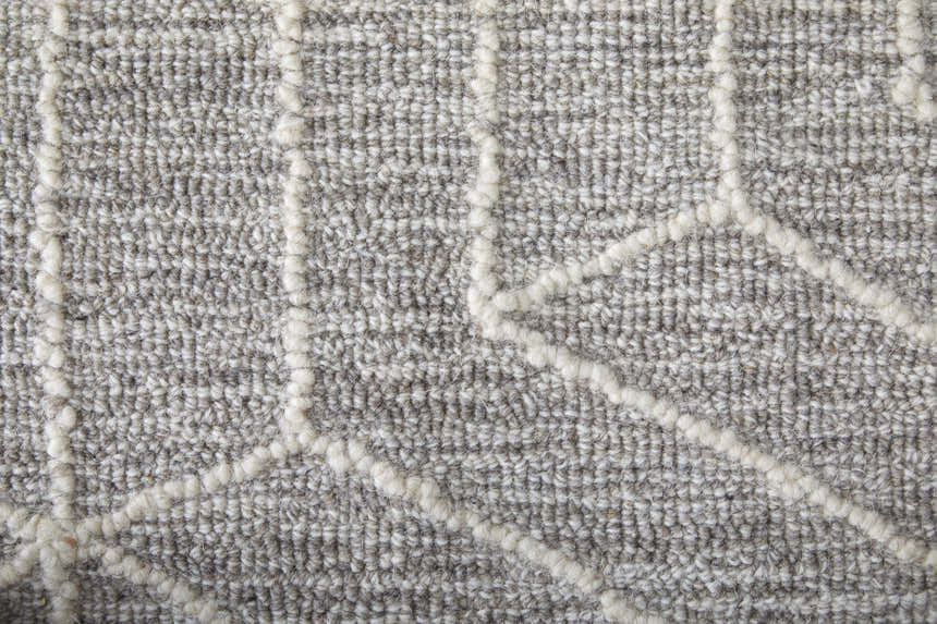 Close-up of the Feizy Emerson rug showing gray wool texture with ivory geometric lines. Texture