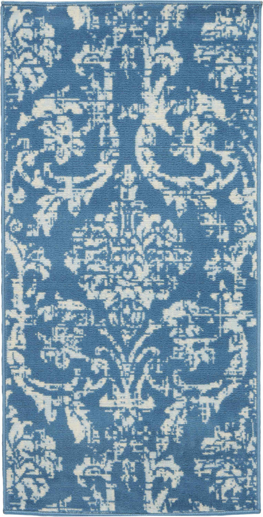 Close-up of Nourison Jubilant Blue Vintage Indoor Area Rug with a distressed damask pattern.
