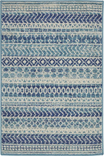 Close-up of Nourison Passion Navy Blue rug. Features a bohemian pattern in shades of blue and white.