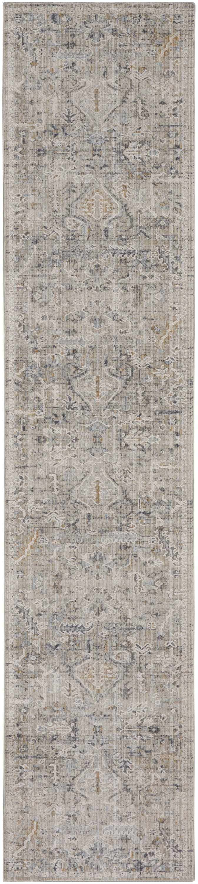Close-up of the Nourison Lynx Ivory Taupe Vintage Indoor Area Rug. Features a distressed vintage pattern in ivory, taupe, and gray.