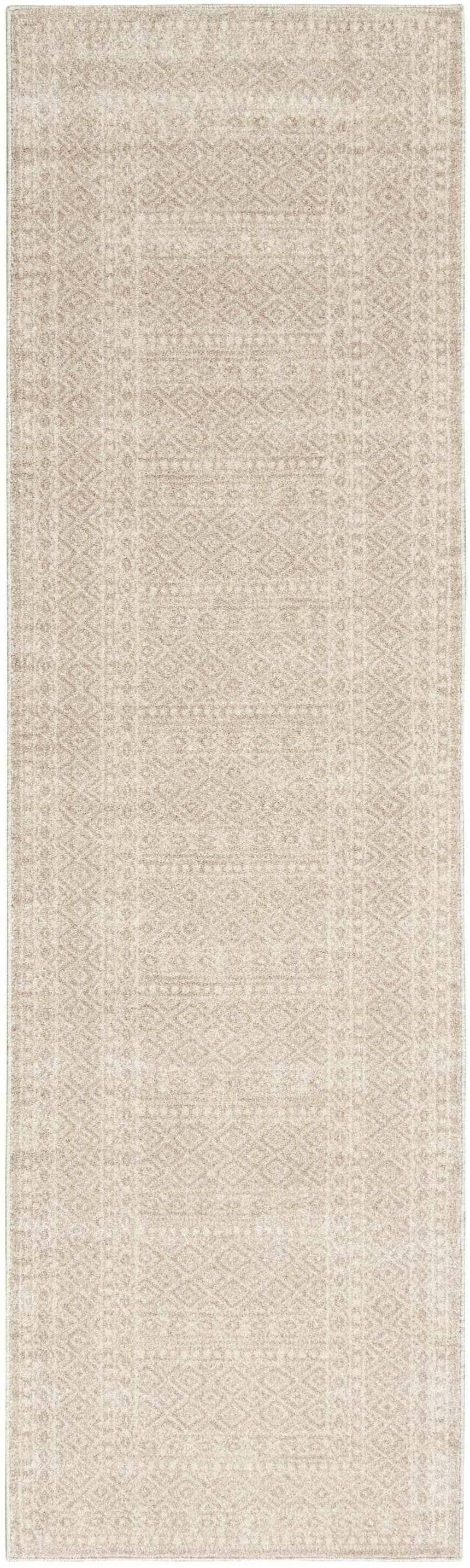 Close-up of a Nourison Palermo Beige Bohemian Area Rug featuring a subtle geometric pattern.
