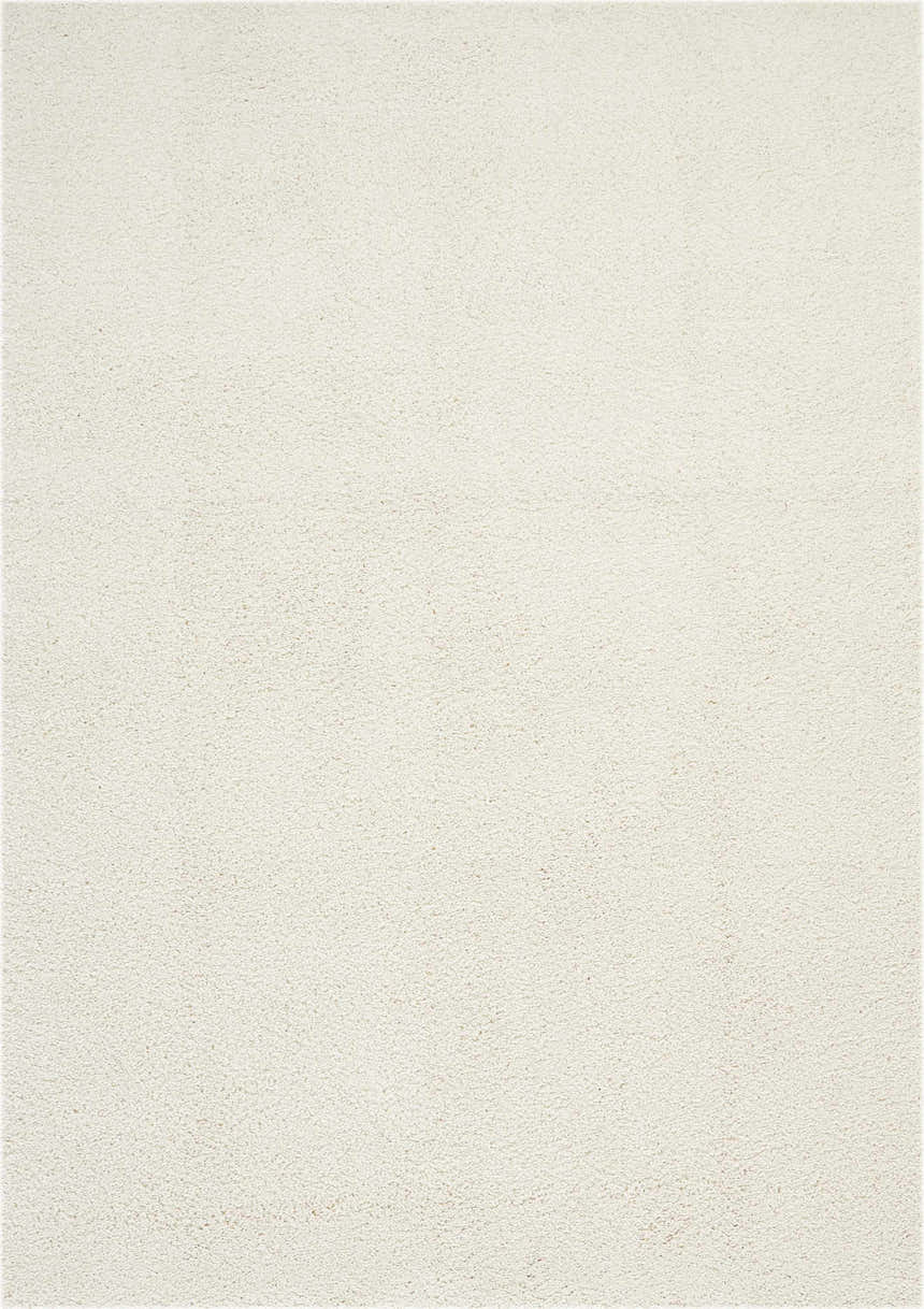 Close-up of the plush texture of the Nourison Malibu Shag Ivory area rug. Soft, off-white shag rug.