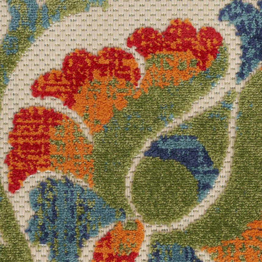 Close-up of the Nourison Aloha Red Multicolor Farmhouse Area Rug, showing its floral pattern and textured weave.