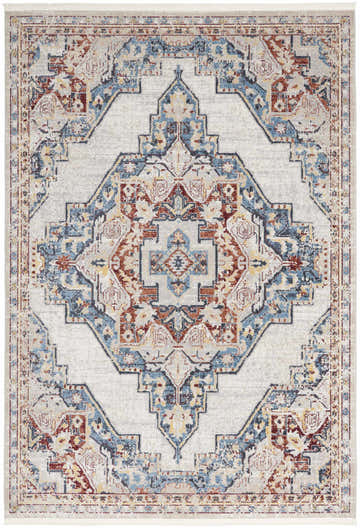 Close-up of the Nourison Carina Multicolor Vintage Area Rug, featuring a distressed geometric pattern in blue, rust, and cream.