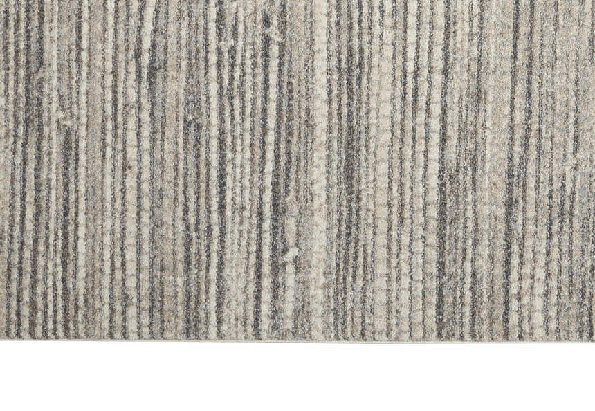 Close-up of the Calvin Klein Etched Ivory Grey rug, featuring a textured, striated pattern in neutral tones.
