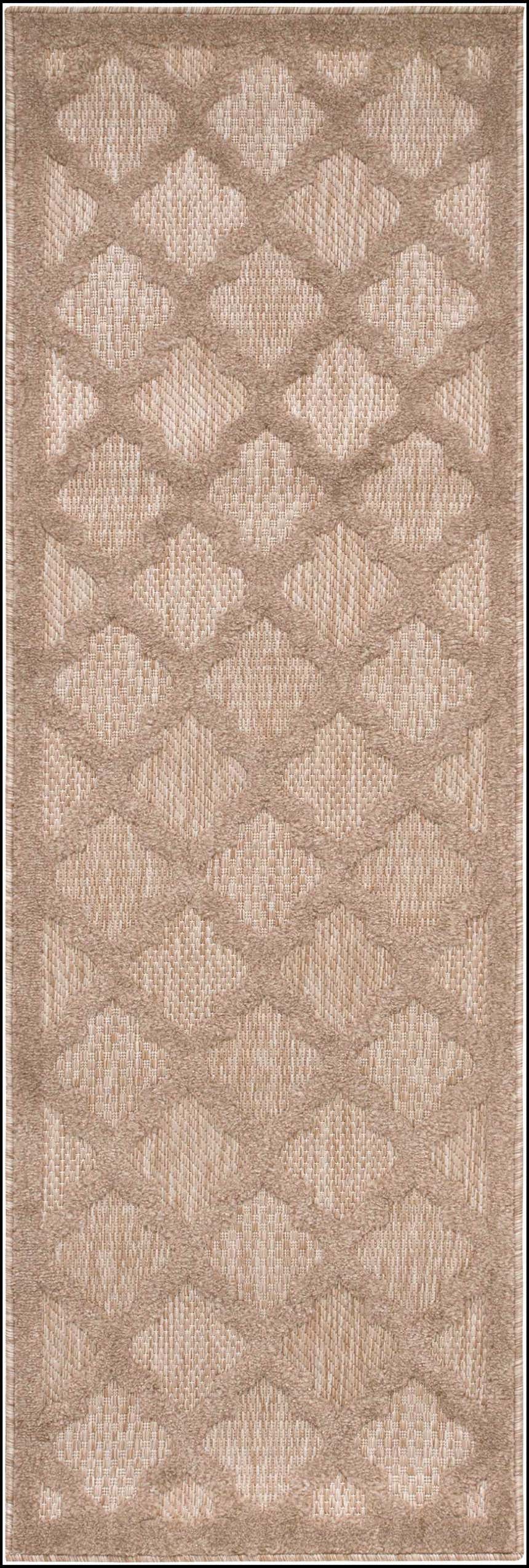 Close-up of Nourison Easy Care Natural Beige rug. Neutral rug features a diamond trellis pattern and textured weave.