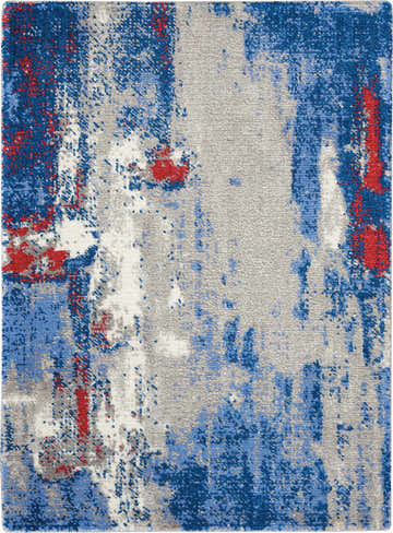Close-up of Nourison Twilight Grey Blue rug. Abstract pattern with blue, gray, and red accents. Mid-century modern style.