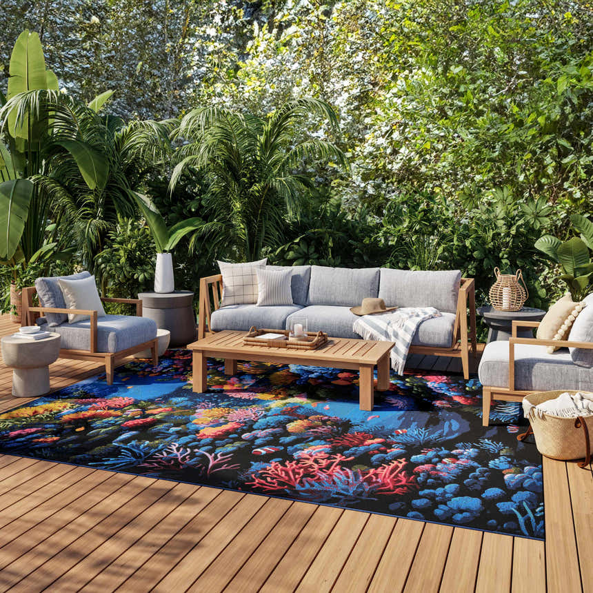 Coastal deck with gray furniture and Nourison Color Splash Multicolor area rug featuring a vibrant coral reef design.
