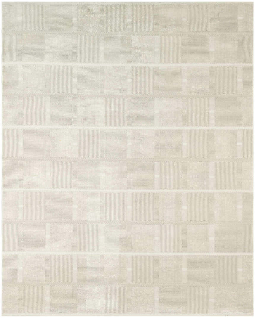 Close-up of the Nourison Nordic Ivory Beige rug. Modern, machine-made design with chestnut accents and a subtle geometric pattern.