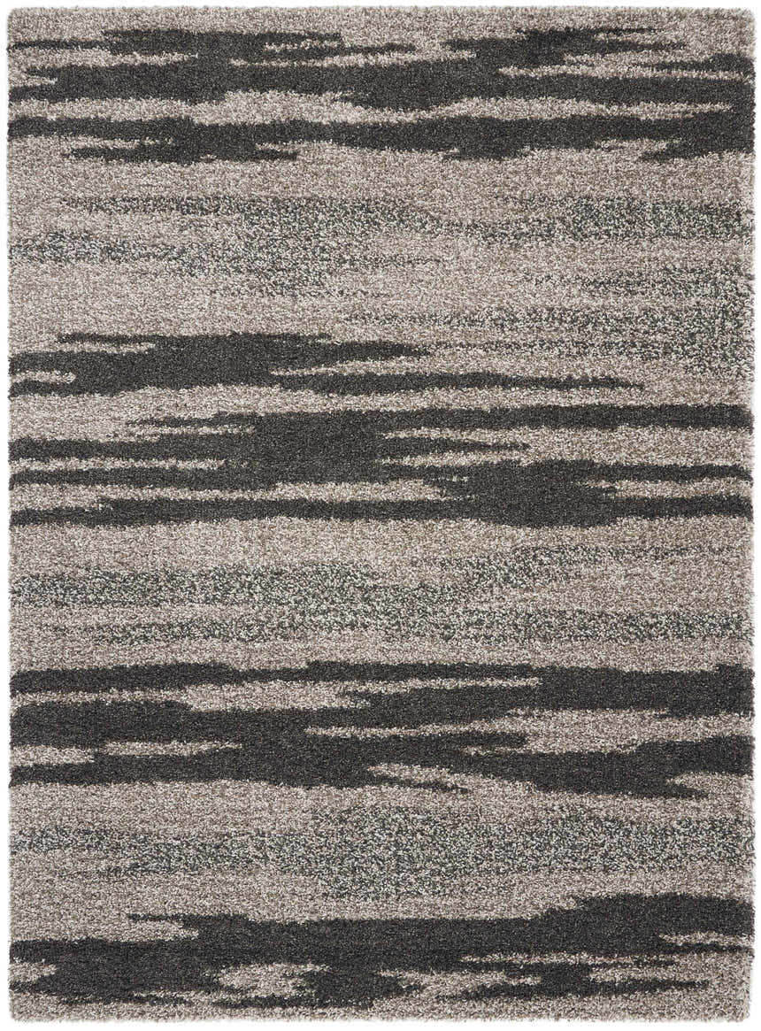 Close-up of the Nourison Amore Marble Shag rug. Soft, high-pile texture with a horizontal marble-like pattern in gray and charcoal.