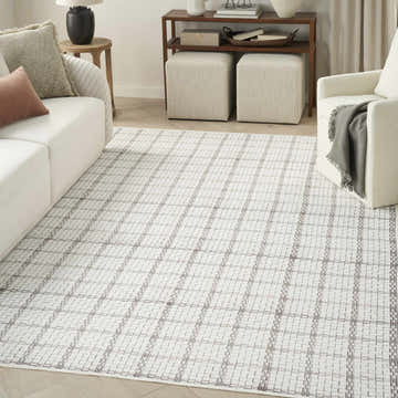 Modern living room with white sofa and Nourison Ivory Modern Indoor Washable Area Rug in chestnut.