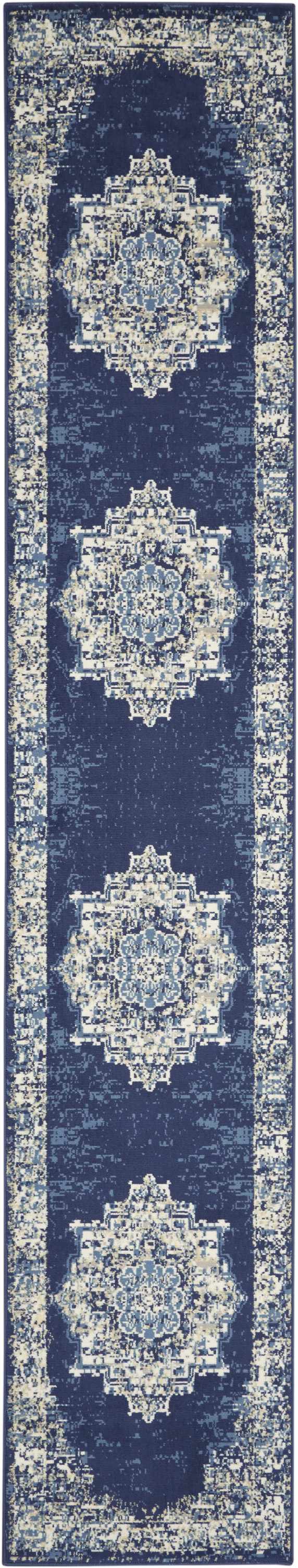 Close-up of the Nourison Grafix Navy Blue Vintage Area Rug, featuring a detailed, symmetrical, distressed pattern.