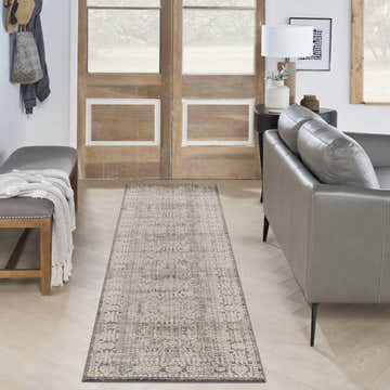 Entryway with gray leather sofa and Nourison Lynx Ivory Slate Vintage Indoor Area Rug runner.