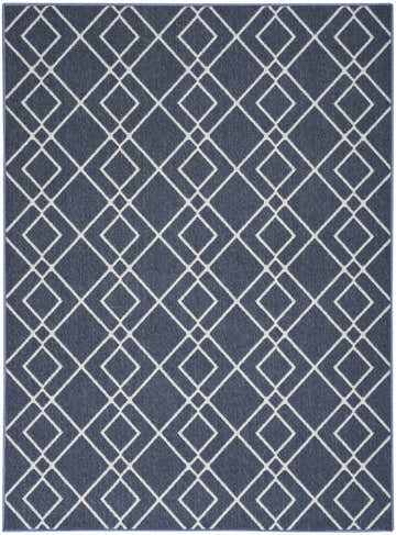 Close-up of the Nourison Modern Lines Denim rug, featuring a geometric diamond pattern in denim blue and white.