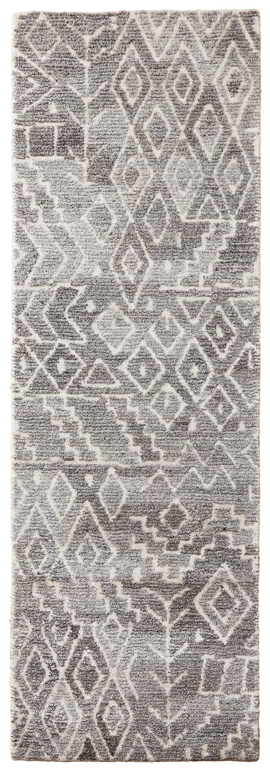 Close-up of Feizy Asher Transitional Distressed rug; gray and white geometric pattern, hand-tufted texture. Design-Runner