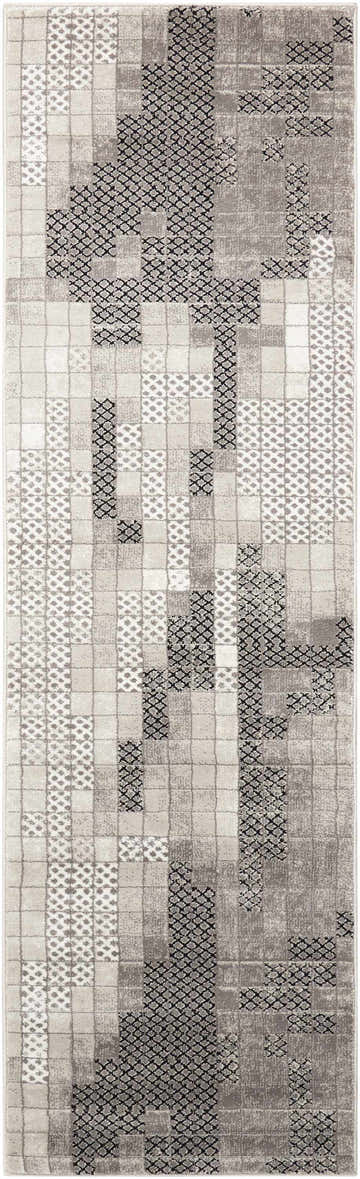 Close-up of the Nourison Soho Grey rug featuring a geometric pattern in shades of gray, black and white.