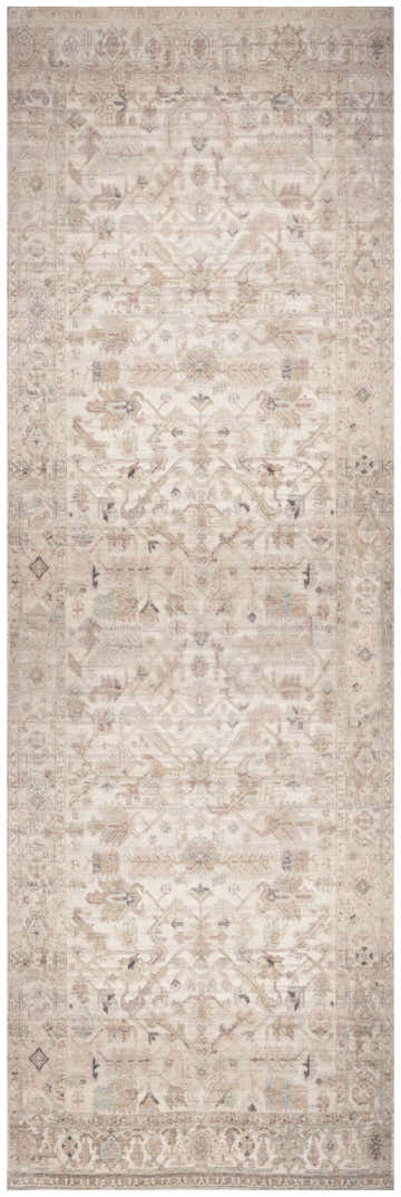 Close-up of the beige Nourison Vintage Washable Area Rug, featuring an ornate vintage pattern and subtle color variations.