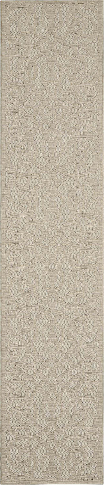 Close-up of the cream Nourison Cozumel Farmhouse area rug, featuring a subtle geometric pattern and textured weave.