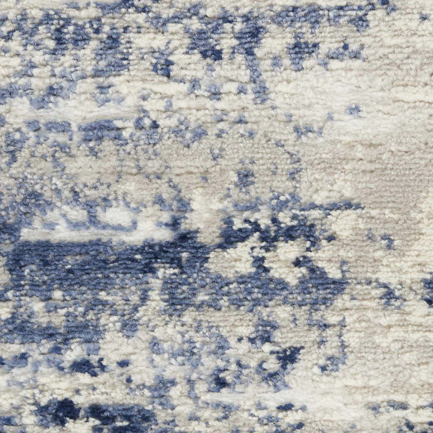 Close-up of the plush Nourison Cyrus Ivory Navy rug, showing its abstract pattern and soft texture.