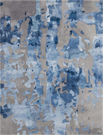 Close-up of the Nourison Prismatic Blue Grey rug featuring a modern abstract pattern in shades of blue and gray.