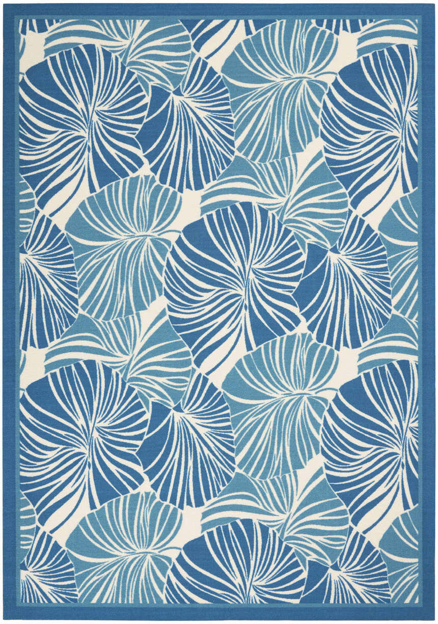 Close-up of the Waverly Sun N' Shade Blue Tropical Area Rug, featuring a light blue palm leaf pattern.