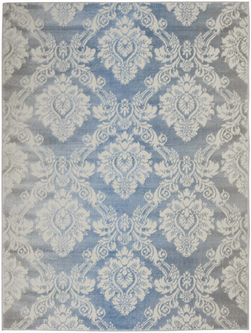 Close-up of Nourison Elation Ivory Blue Vintage rug. High pile texture with a chestnut, damask-style pattern. Machine made.