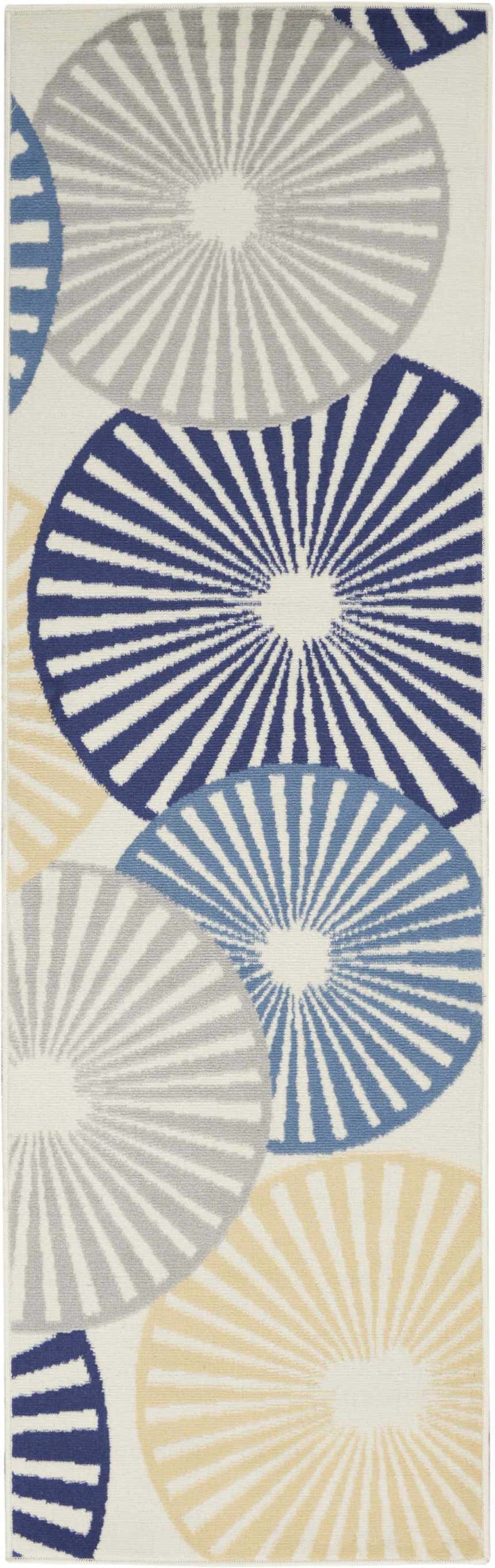 Close-up of Nourison Grafix White rug featuring blue, gray, and yellow radiating circle pattern. Contemporary style.