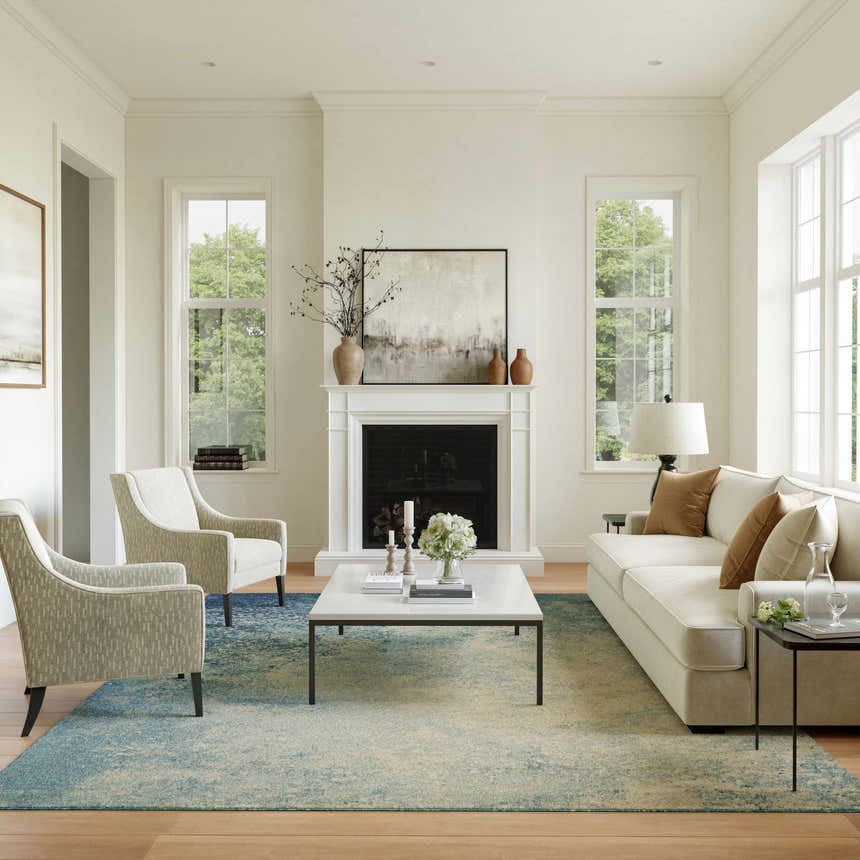 Living room with a Nourison Passion Navy Light Blue rug, white sofa, fireplace, and natural light.