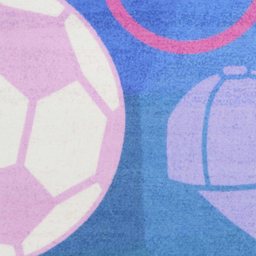 Close-up of the Nourison Imagination Purple Kids Rug, featuring a soccer ball and cap design.